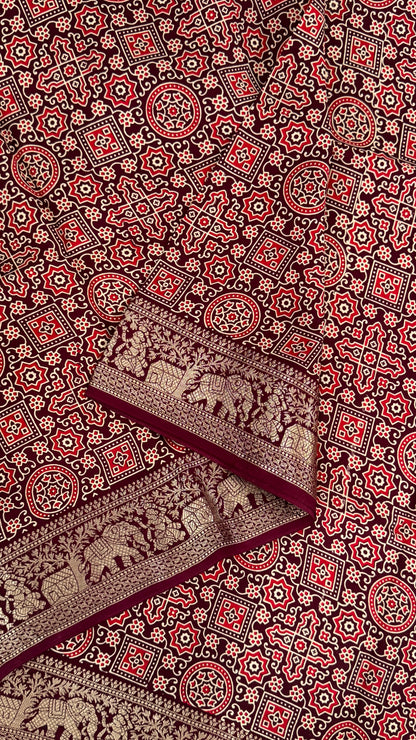 Pure Modal Based Saree with Ajrakh Prints & Banarasi Elephant Zari Border – Deep Maroon