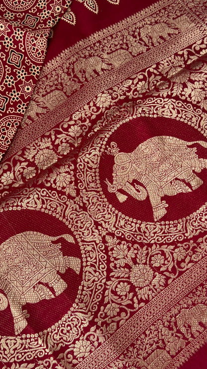 Pure Modal Based Saree with Ajrakh Prints & Banarasi Elephant Zari Border – Maroon