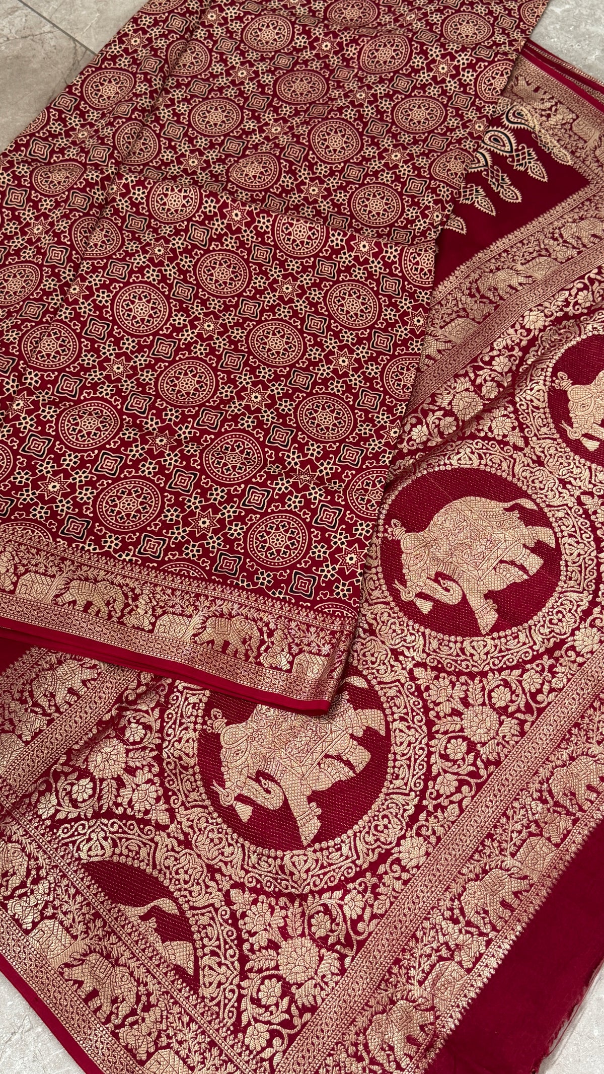 Pure Modal Based Saree with Ajrakh Prints & Banarasi Elephant Zari Border – Maroon