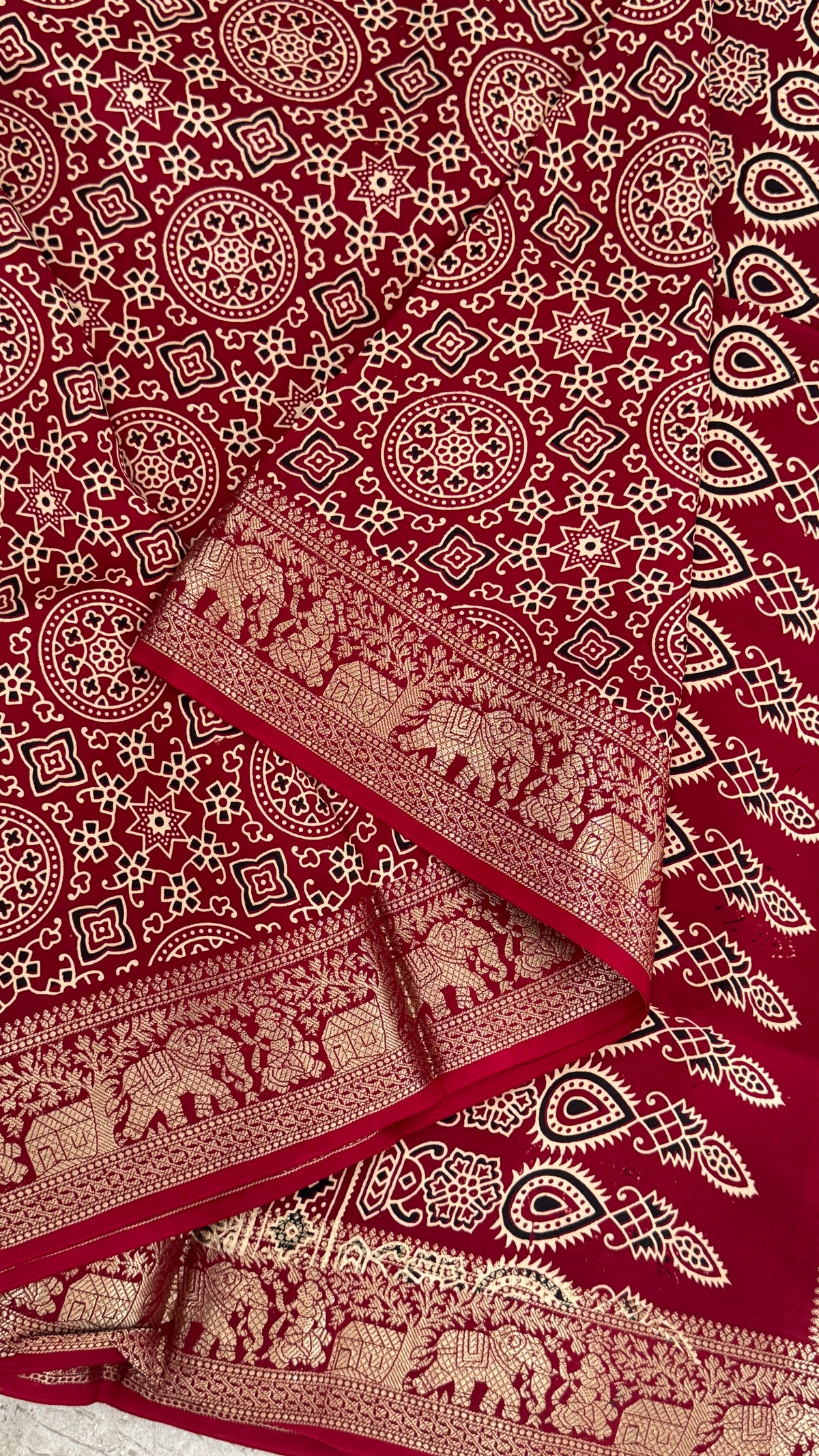 Pure Modal Based Saree with Ajrakh Prints & Banarasi Elephant Zari Border – Maroon