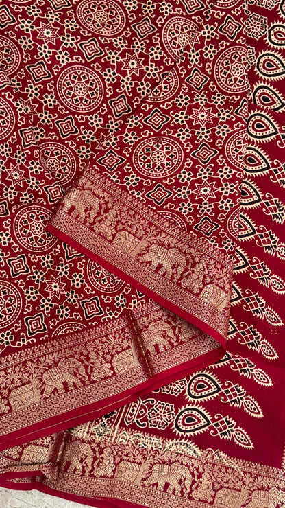 Pure Modal Based Saree with Ajrakh Prints & Banarasi Elephant Zari Border – Maroon