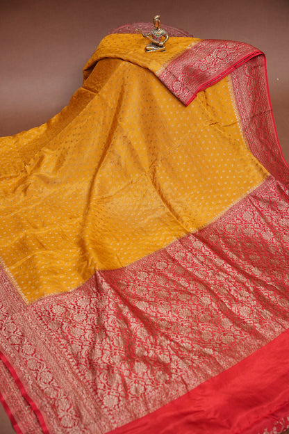 Khaddi Georgette Crepe Silk Saree with Antique Border – Yellow & Red