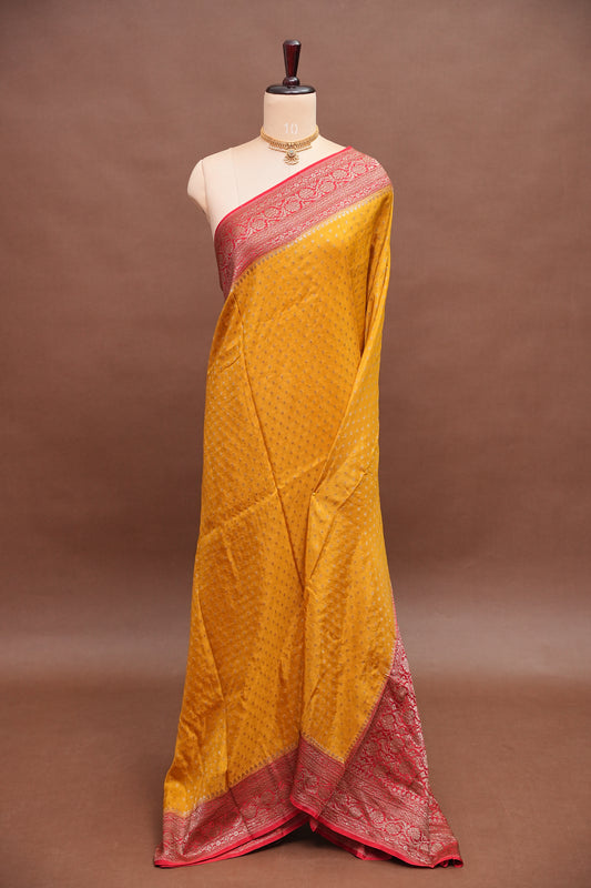 Khaddi Georgette Crepe Silk Saree with Antique Border – Yellow & Red