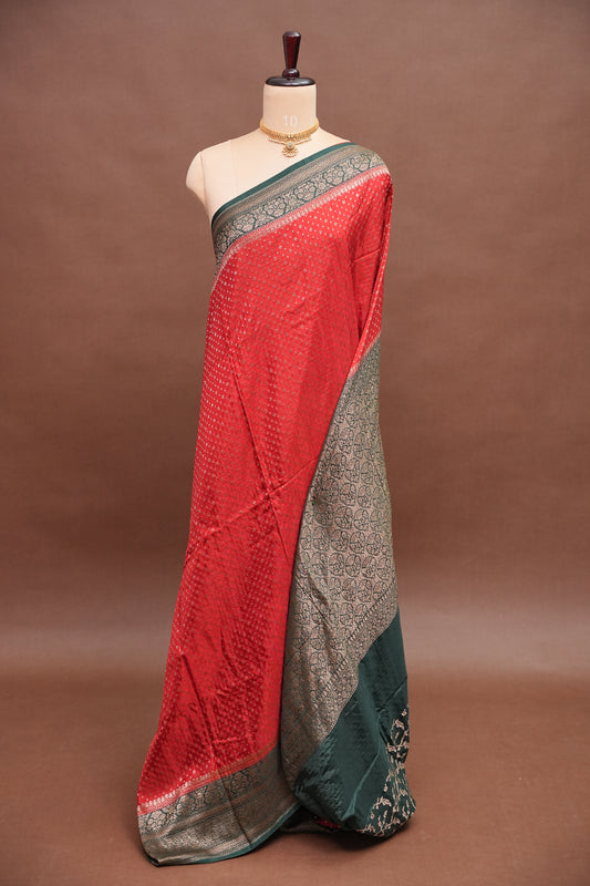 Khaddi Georgette Crepe Silk Saree with Antique Border – Red & Bottle Green