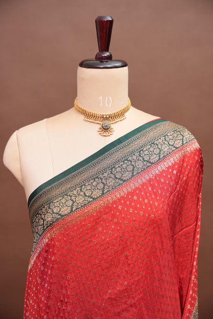 Khaddi Georgette Crepe Silk Saree with Antique Border – Red & Bottle Green
