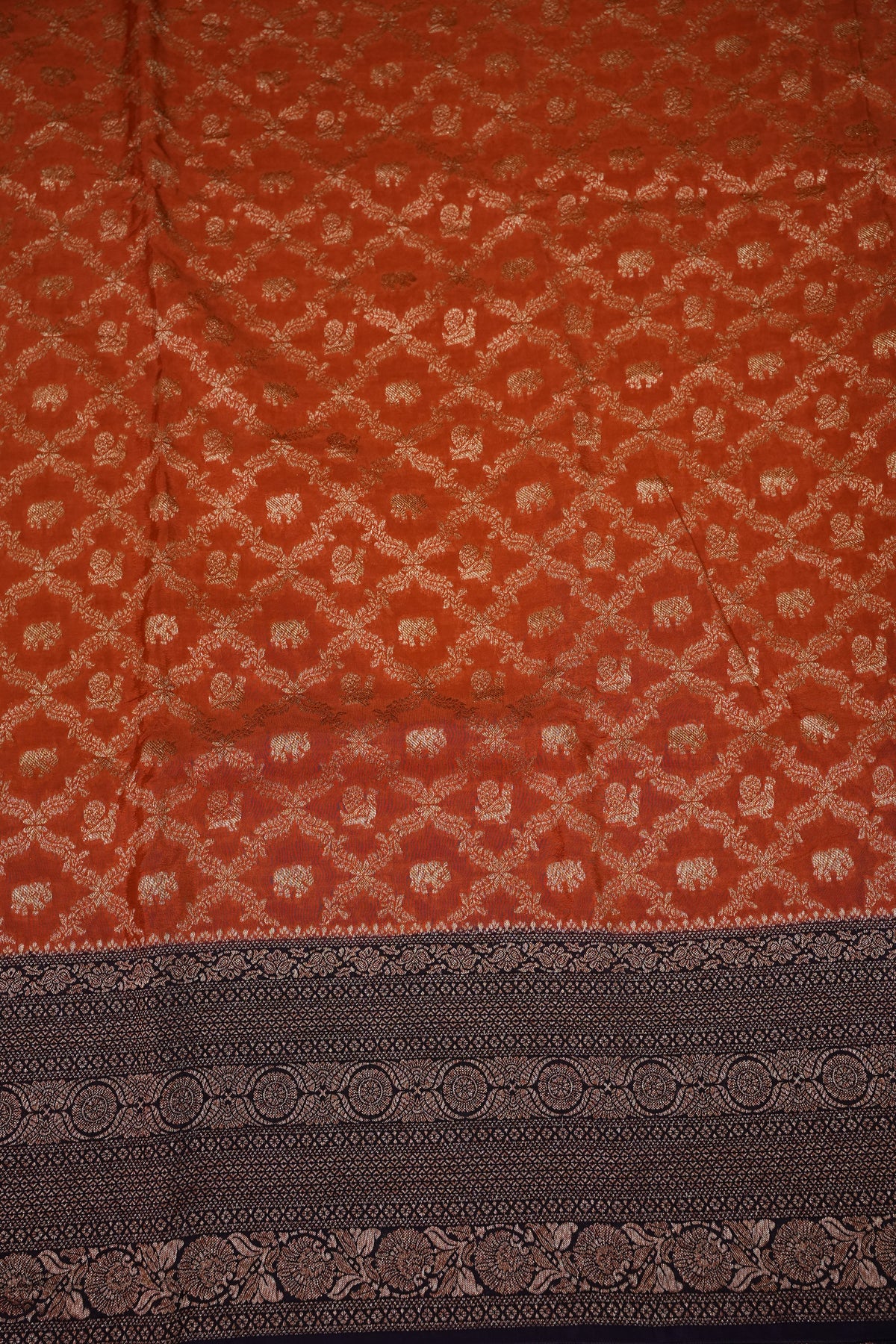 Banarasi Tussar Georgette Saree with Geometric Jaal Weave – Rust & Aubergine Purple