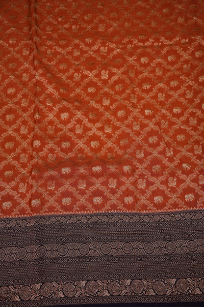 Banarasi Tussar Georgette Saree with Geometric Jaal Weave – Rust & Aubergine Purple