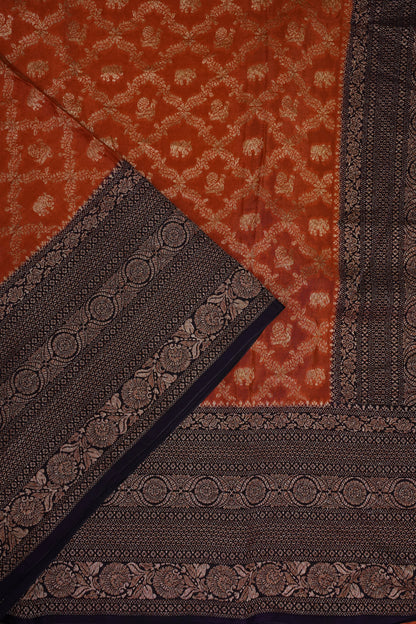 Banarasi Tussar Georgette Saree with Geometric Jaal Weave – Rust & Aubergine Purple