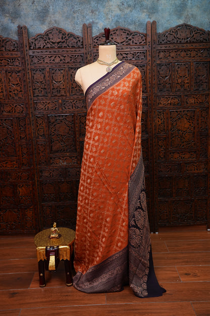 Banarasi Tussar Georgette Saree with Geometric Jaal Weave – Rust & Aubergine Purple