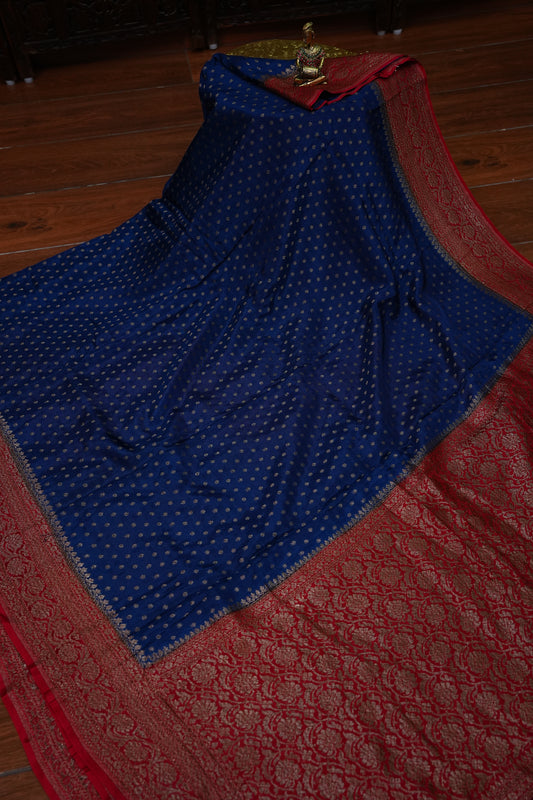 Khaddi Georgette Crepe Silk Saree with Antique Border – Peacock Blue & Red