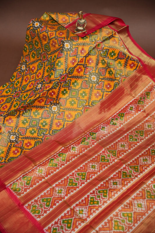 Mustard Yellow Pochampally Ikkat Silk Saree with Red Tissue Border