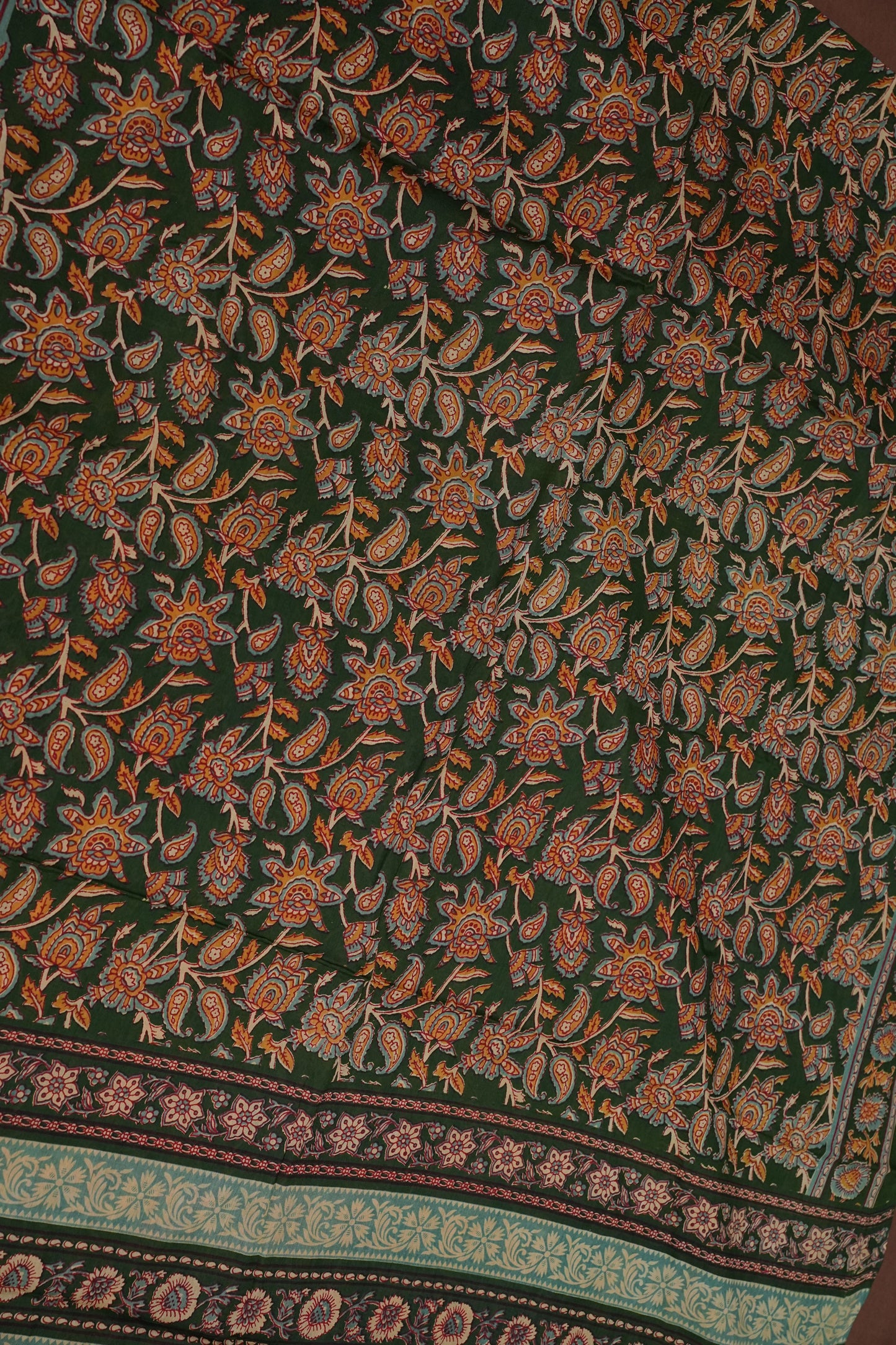 Kalamkari Cotton Saree – Deep Forest Green with Traditional Floral & Border Prints
