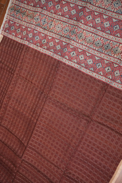 Tussar Raw Silk Saree with Checkered Body & Ajrakh Printed Pallu and Blouse – Rust Brown & Beige