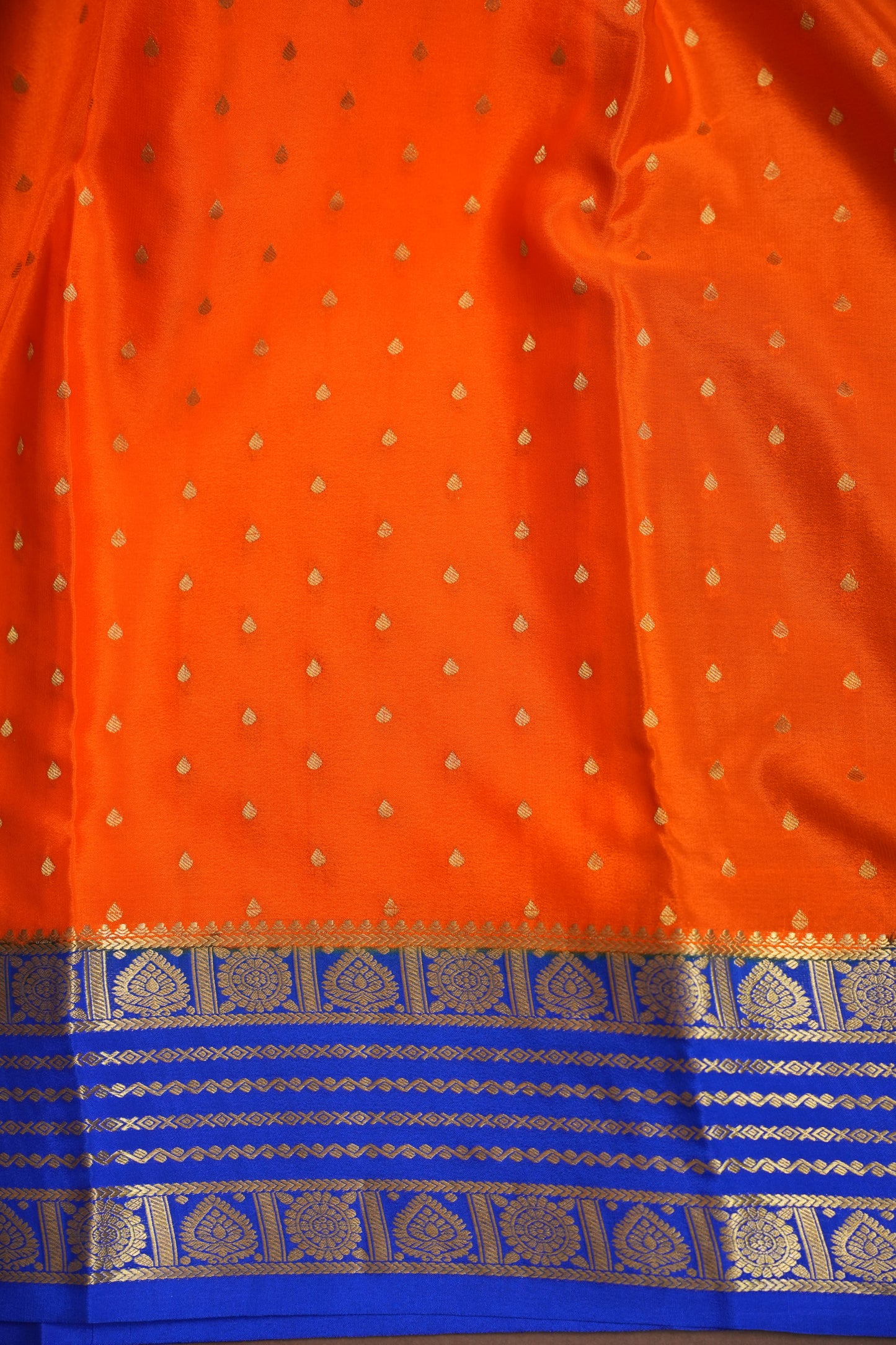 Pure Crepe Mysore Silk Saree in Orange With Contrast Ink Blue Border