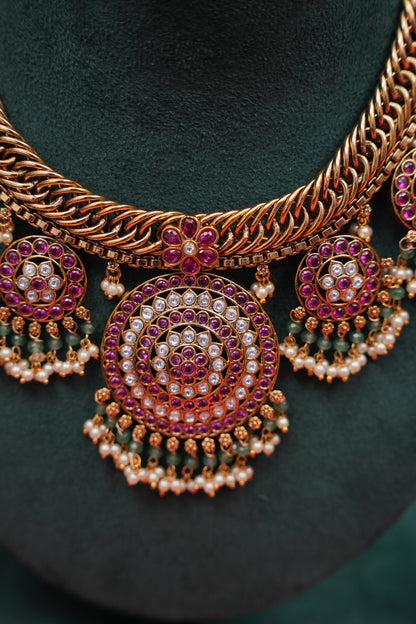 Grand Statement Antique Gold-Plated Temple Haaram Set with Ruby Stone Detailing