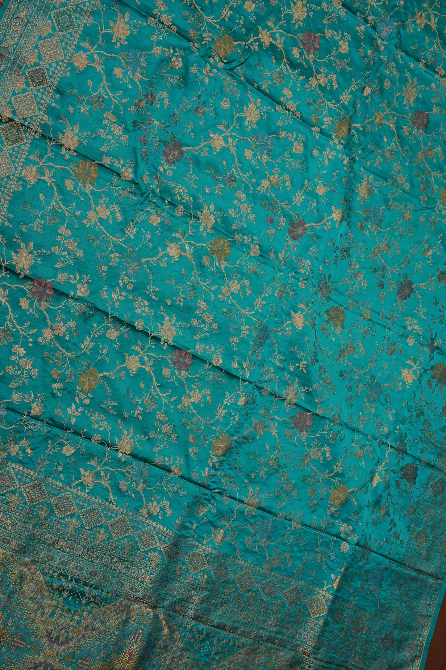 Turquoise Blue Banarasi Satin Silk Saree with Meenakari Floral Zari Weave & Rich Brocade Border-Silk Mark Certified.