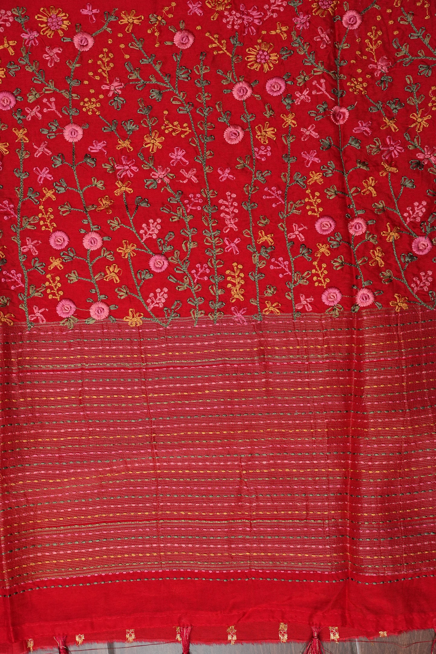 Bright Red Crepe silk saree with French knot work.