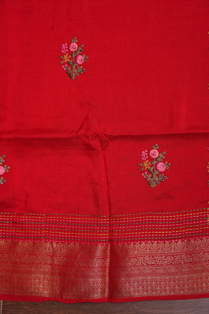 Bright Red Crepe silk saree with French knot work.