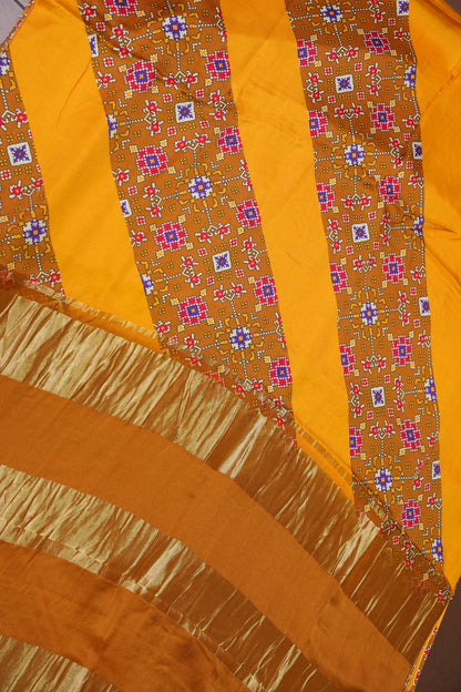 Gajji Silk Saree with Mustard Yellow Panels & Warm Caramel Brown Patola Prints