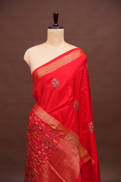 Bright Red Crepe silk saree with French knot work.