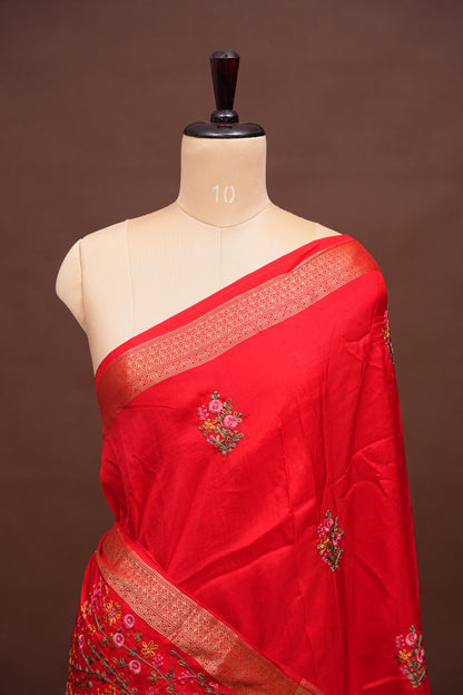 Bright Red Crepe silk saree with French knot work.
